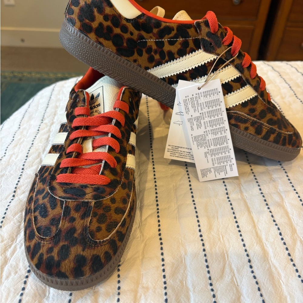 Women’s Adidas Sambas in Leopard print with red laces.